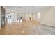 Bright, open living room with tile floors, recessed lighting, and large doorways to additional rooms and waterfront views at 1931 Kentucky Ne Ave, St Petersburg, FL 33703