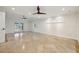 Bright and airy living room with tile flooring, neutral paint, ceiling fan and sliding glass doors at 1931 Kentucky Ne Ave, St Petersburg, FL 33703