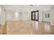 Spacious living room with tile floors, recessed lights, and double doors that let in natural light and lead to the outside at 1931 Kentucky Ne Ave, St Petersburg, FL 33703
