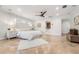 Bright main bedroom features tile flooring, tray ceiling, and ensuite bathroom at 1931 Kentucky Ne Ave, St Petersburg, FL 33703
