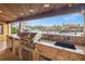 Covered outdoor kitchen with stainless steel appliances and a view of the water and other houses at 1931 Kentucky Ne Ave, St Petersburg, FL 33703