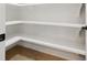 Walk-in pantry with ample shelving space for organized storage at 1931 Kentucky Ne Ave, St Petersburg, FL 33703