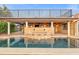 The backyard features a pool with a stone bar and a waterfall feature, perfect for relaxing or entertaining at 1931 Kentucky Ne Ave, St Petersburg, FL 33703