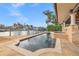 Backyard pool and dock offer serene waterfront living and relaxation at 1931 Kentucky Ne Ave, St Petersburg, FL 33703