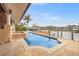 Beautiful backyard pool and dock with boat lift provide waterfront living at 1931 Kentucky Ne Ave, St Petersburg, FL 33703