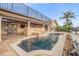 Outdoor living area features a luxurious pool and spa with patio at 1931 Kentucky Ne Ave, St Petersburg, FL 33703