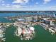 Aerial view of a condo community on the water with boat docks at 200 Skiff Pt # 202, Clearwater Beach, FL 33767