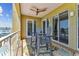 Balcony with ceiling fan, beautiful outdoor rug, and amazing water view at 200 Skiff Pt # 202, Clearwater Beach, FL 33767