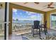 Balcony with ceiling fan, outdoor rug, and lovely water view at 200 Skiff Pt # 202, Clearwater Beach, FL 33767