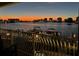 Balcony view overlooking waterfront and city lights at dusk at 200 Skiff Pt # 202, Clearwater Beach, FL 33767