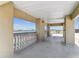 Spacious balcony offering beautiful water views, featuring neutral tones and elegant railings at 200 Skiff Pt # 202, Clearwater Beach, FL 33767