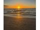 Sunset on the beach with calm waves at 200 Skiff Pt # 202, Clearwater Beach, FL 33767