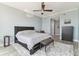 Bedroom featuring a ceiling fan and small table on a rug with balcony access at 200 Skiff Pt # 202, Clearwater Beach, FL 33767