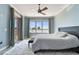 Bright bedroom with floor to ceiling windows overlooking water; access to balcony at 200 Skiff Pt # 202, Clearwater Beach, FL 33767
