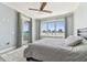 Bedroom with ensuite bathroom and large windows providing ample sunlight and great views at 200 Skiff Pt # 202, Clearwater Beach, FL 33767