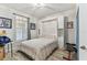 Neutral bedroom design with a built-in Murphy bed and wood flooring at 200 Skiff Pt # 202, Clearwater Beach, FL 33767