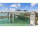 Boat on boatlift at private boat dock behind the property at 200 Skiff Pt # 202, Clearwater Beach, FL 33767