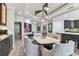 Bright dining room with a modern table and chairs, stylish lighting, and access to other living spaces at 200 Skiff Pt # 202, Clearwater Beach, FL 33767