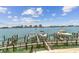 View of boat docks on the water with city views in the background at 200 Skiff Pt # 202, Clearwater Beach, FL 33767