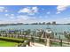 View of boat docks on the water with city views in the background at 200 Skiff Pt # 202, Clearwater Beach, FL 33767