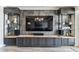 Custom entertainment center featuring a flat screen television and stylish decorations at 200 Skiff Pt # 202, Clearwater Beach, FL 33767