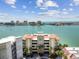 Majestic Point waterfront condo with lush landscaping and city views at 200 Skiff Pt # 202, Clearwater Beach, FL 33767