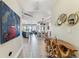 Inviting foyer showcasing an open floor plan with modern decor and wood-look tile flooring at 200 Skiff Pt # 202, Clearwater Beach, FL 33767