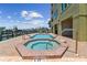 Community hot tub and pool area with access to the harbor at 200 Skiff Pt # 202, Clearwater Beach, FL 33767