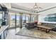 Bright living room with water views, sliding doors to balcony and luxury furnishings at 200 Skiff Pt # 202, Clearwater Beach, FL 33767