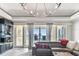 Living room with sliding doors to the patio and water views at 200 Skiff Pt # 202, Clearwater Beach, FL 33767