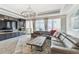 The living room is spacious and modern, complete with a large leather couch, and a rustic-style coffee table at 200 Skiff Pt # 202, Clearwater Beach, FL 33767