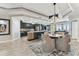 Open living space featuring kitchen, dining area, and living room, showcasing continuity through decor and color scheme at 200 Skiff Pt # 202, Clearwater Beach, FL 33767