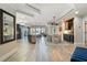 Expansive open-concept living area showcasing the kitchen, dining area, and living room, unified by wood-look tile flooring at 200 Skiff Pt # 202, Clearwater Beach, FL 33767