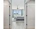 Charming main bedroom with water views, ceiling fan, and neutral carpet at 200 Skiff Pt # 202, Clearwater Beach, FL 33767