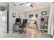 This office has modern decor, ceiling fan, and a glass desk which creates a professional and comfortable workspace at 200 Skiff Pt # 202, Clearwater Beach, FL 33767