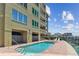 Community pool and jacuzzi situated next to the harbor at 200 Skiff Pt # 202, Clearwater Beach, FL 33767