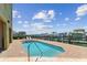 Community pool featuring a waterfront view and easy access to the marina at 200 Skiff Pt # 202, Clearwater Beach, FL 33767