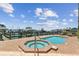 Pool and hot tub next to the pier overlooking the water at 200 Skiff Pt # 202, Clearwater Beach, FL 33767