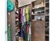Custom closet features built-in shelving and ample storage for shoes, clothes, and accessories at 200 Skiff Pt # 202, Clearwater Beach, FL 33767