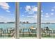 A stunning waterfront view, seen through the windows, with boat docks at 200 Skiff Pt # 202, Clearwater Beach, FL 33767