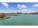Beautiful waterfront view showcasing the sparkling water and cityscape in the distance on a bright, sunny day at 200 Skiff Pt # 202, Clearwater Beach, FL 33767