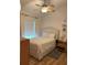 Cozy bedroom with natural light, ceiling fan, and carpeted floor at 20938 Sunsweet Ct, Land O Lakes, FL 34637