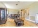 Spacious dining room with hardwood floors, ornate furniture, and ample natural light at 2124 Rensselaer Dr, Wesley Chapel, FL 33543