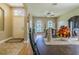 Inviting dining room with hardwood floors, arched windows with shutters, and elegant furnishings at 2124 Rensselaer Dr, Wesley Chapel, FL 33543