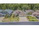Beautiful single-Gathering home with a manicured lawn, garden beds, and a spacious three-car garage at 2124 Rensselaer Dr, Wesley Chapel, FL 33543