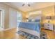 This main bedroom has hardwood floors and sliding glass door to the lanai at 2124 Rensselaer Dr, Wesley Chapel, FL 33543