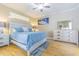 This main bedroom features hardwood floors and neutral paint at 2124 Rensselaer Dr, Wesley Chapel, FL 33543