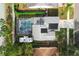 Overhead view of a single Gathering home featuring a screened in pool and solar panels at 2318 Kenwick Dr, Valrico, FL 33596