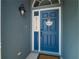 Charming front door with welcome signs, showing curb appeal at 2318 Kenwick Dr, Valrico, FL 33596