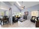 Bright living room featuring vaulted ceilings, tile floors, and stylish furnishings at 2318 Kenwick Dr, Valrico, FL 33596